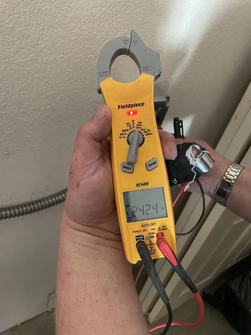 Voltage testing with clamp meter during Ceiling Fan Installation in Yarmouth